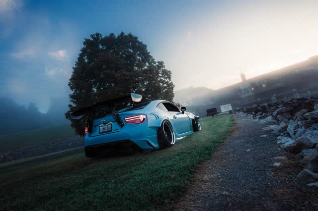 Magazine spread, a car in morning fog